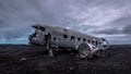 Dismantled aircraft wreckage of a DC3 in Solheimasandur in the black volcanic sand on Iceland.