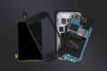 Dismantled mobile phone with broken display screen isolated on d