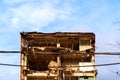 dismantled old building. Half demolished house, dismantling of the old one for the construction of a new building