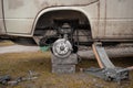 Dismantled parts of a front suspension assembly of a vintage truck. Front arms, coil spring and already removed brake caliper Royalty Free Stock Photo