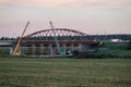 Dismantling the old bridge in the Kaluga region of Russia on the Ugra river.