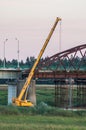 Dismantling the old bridge in the Kaluga region of Russia on the Ugra river.
