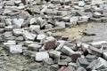 Dismantling of paving stones on a city street. Construction of new pedestrian roads and landscaping. Selective focus Royalty Free Stock Photo