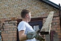 dismantling the roof. The worker removes old boards. Royalty Free Stock Photo