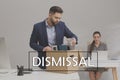 Dismissed man packing personal stuff into box in office Royalty Free Stock Photo