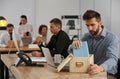 Dismissed man packing stuff into box at office Royalty Free Stock Photo