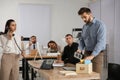 Dismissed man packing stuff into box at office Royalty Free Stock Photo