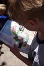 Boy Reading Disneyland Map