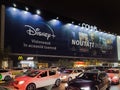 Disney Plus streaming entertainment provider advertising poster with series photos on display at a giant street banner with