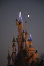 Disneyland Paris, France, November 2018: Moon over Sleeping Beauty`s Castle