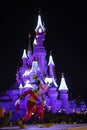 Disneyland Paris, France, November 2018: Pluto Sleeping Beauty`s Castle at night