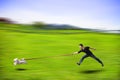 Disobedient dog running fast and dragging a man by the leash Royalty Free Stock Photo