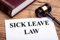 Sick Leave Law Documents With Book And Gavel