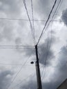 Disorganized telephone pole wires under the sky Royalty Free Stock Photo