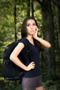 Disoriented Hiking Girl with Travel Backpack