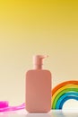 Dispenser with shower gel or shampoo for children with a comb and a toy. Skin and hair care Royalty Free Stock Photo