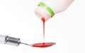 Dispensing of a syrup for cough in a spoon Royalty Free Stock Photo