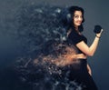 Dispersion effect .Beautiful girl holding a dumbbell