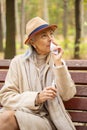 Dispirited woman with a paper tissue looking up