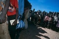 Displace people queue for aid in a camp in Angola