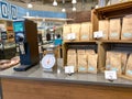 A display of Allegro coffee with a coffee grinder and scale of a Whole Foods Market Grocery Store