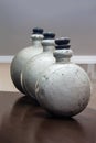 Display of 3 antique metal drug bottles.tif