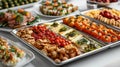 catering services, display an array of delectable appetizers and finger foods on silver trays, ideal for any cocktail
