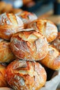 A display of assorted bread rolls is artfully arranged in layers inside a basket Royalty Free Stock Photo