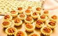 Display of assorted gluten free cupcakes with walnuts sitting o Royalty Free Stock Photo