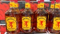 A display of bottles of Fireball Cinnamon Whisky with background bokeh at a Binneys liqour store in Springfield, Illinois