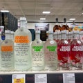 A display of bottles of flavored Absolut Vodka with background bokeh at a Binneys liqour store in Springfield, Illinois