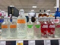 A display of bottles of flavored Absolut Vodka with background bokeh at a Binneys liqour store in Springfield, Illinois