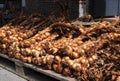 Display of braids of smoked garlic on sale during the garlic festival of the town of Arleux, France