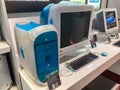 Display case in Apple Technology Museum, Kyiv Showcasing two vintage Apple computers an iMac light blue and white and an older Royalty Free Stock Photo