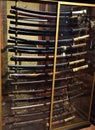 A display case contains dozens of samurai swords, uguli for the length, with relative sheath, in a room of villa Stibbert, in Flor