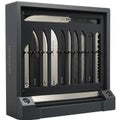 A display case showcasing various knife blades, each held securely within slots. The Royalty Free Stock Photo