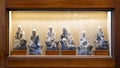 Display of ceramic sitting buddhas in various positions on public display in a resort in Maui, Hawaii