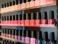 Display of colored nail polish bottles in a beauty center.
