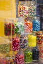 Display of colorful candy in large glass jars