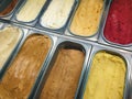 Display of colorful ice creams in metal tubes