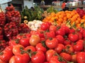 Display of colourful fruit and vegetables on a market stall.