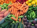 Display of colourful vegetables on a market stall.