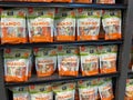 A display of 365 Dried Mango snack packages at a Whole Foods Market