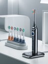Display of an Electric Toothbrush with Multiple Brush Heads Royalty Free Stock Photo