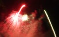 A display of fireworks shooting into the night sky Royalty Free Stock Photo