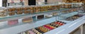 A display of French pastries and baked goods including a variety of donuts, coffee rolls, and muffins