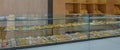 A display of French pastries and baked goods including a variety of donuts, coffee rolls, and muffins