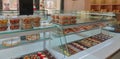 A display of French pastries and baked goods including a variety of donuts, coffee rolls, and muffins