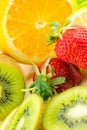 Display of fresh fruit on brightly coloured background Royalty Free Stock Photo