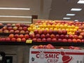 Display of fresh, juicy apples inside a Safeway grocery store, featuring the brand new, made in Washington Cosmic Crisp apples